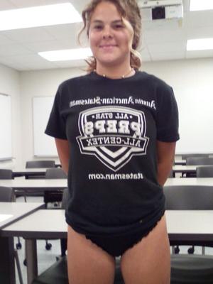 UT Austin Freshman Poses in Classroom