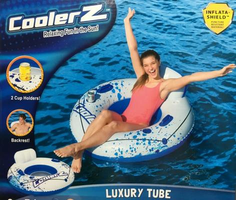 Girl with sexy feet on an inflatable raft box.