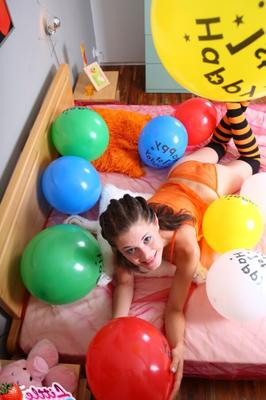 Little Caprice playing with her balloons