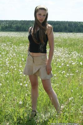 Girl strips and pisses in flower meadow