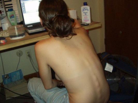 Nude behind her PC