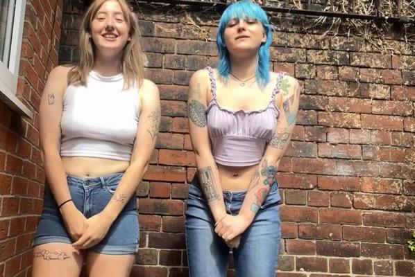 Two crazy young girls piss themselves for a laugh