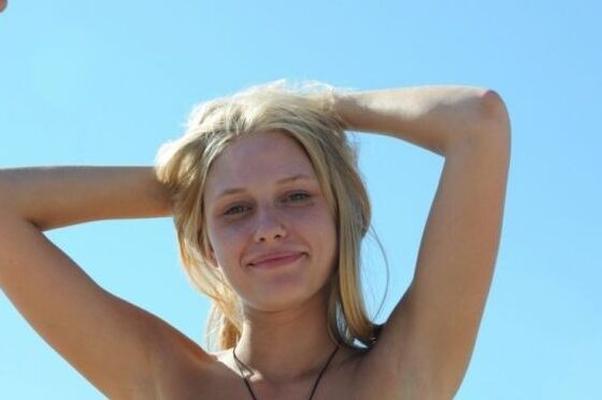 Topless beach beauty